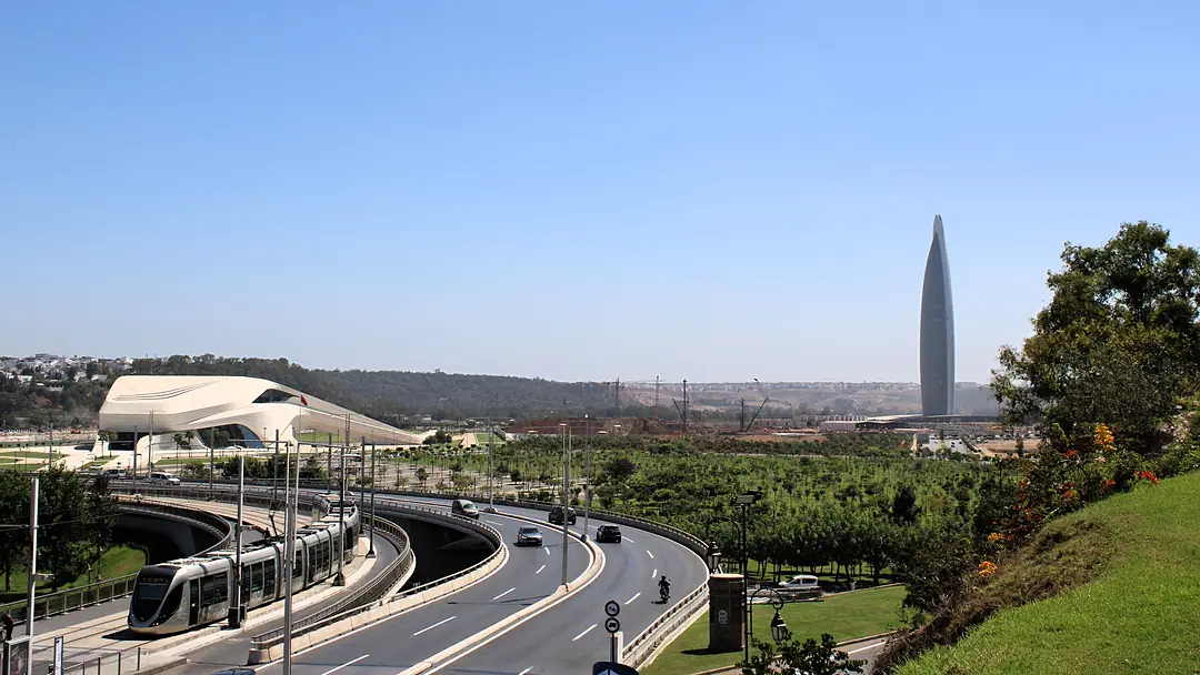 Rabat’s tramway curving past the Grand Theatre, the Mohammed VI Tower on the skyline beyond